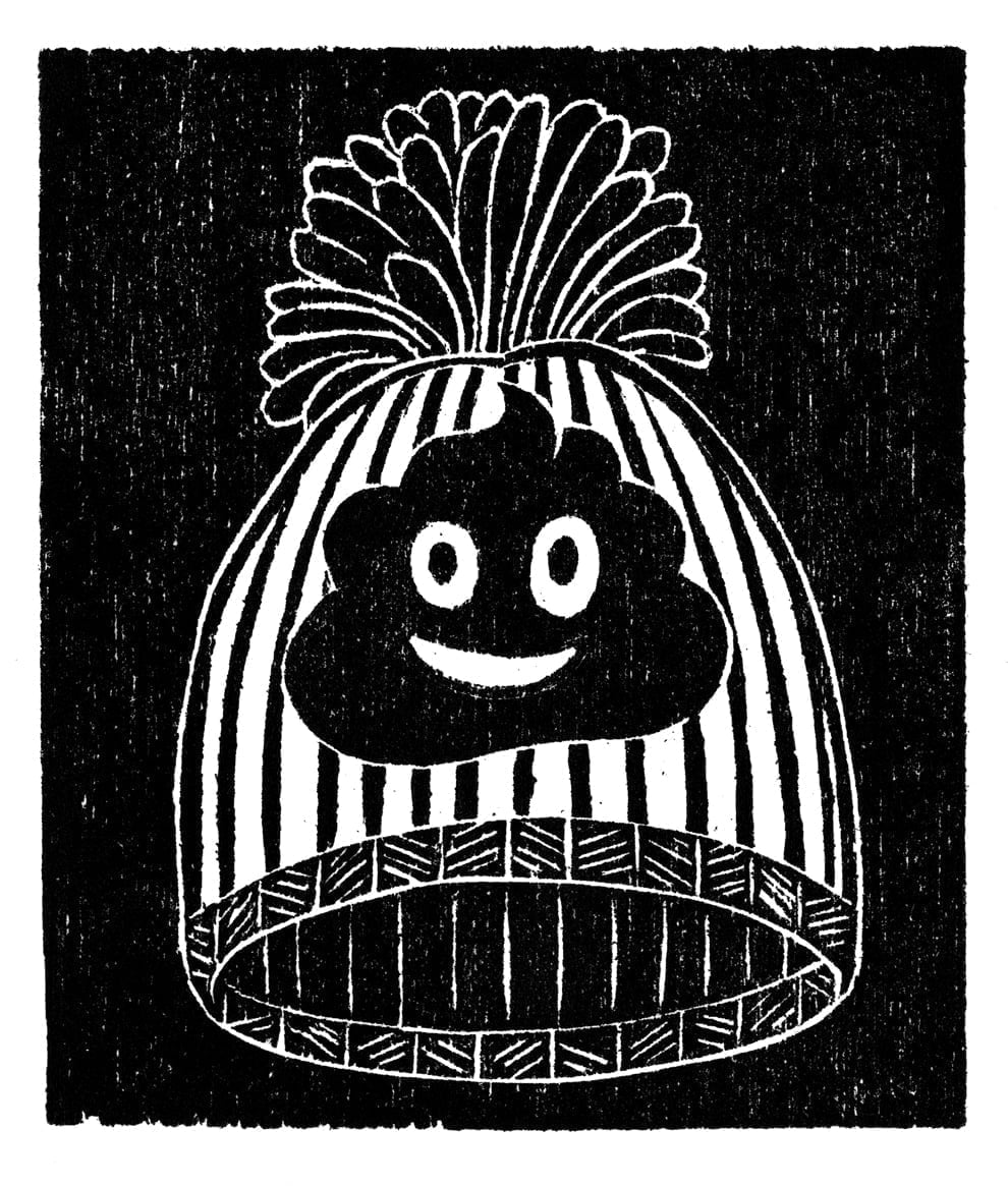 A woodcut illustration of a beanie hat with a smiling poop emoji on it.