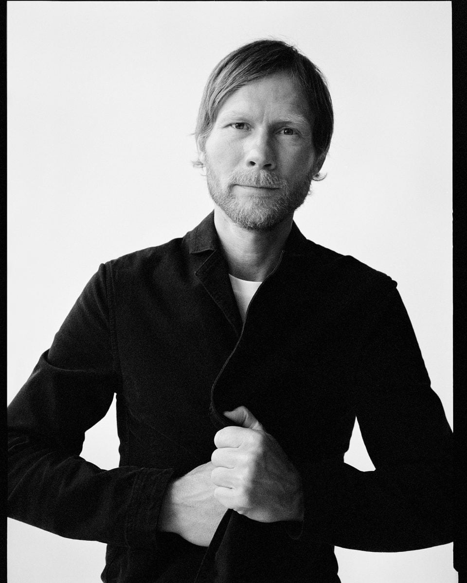 Black and white photo of Rasmus Kofoed looking into the camera