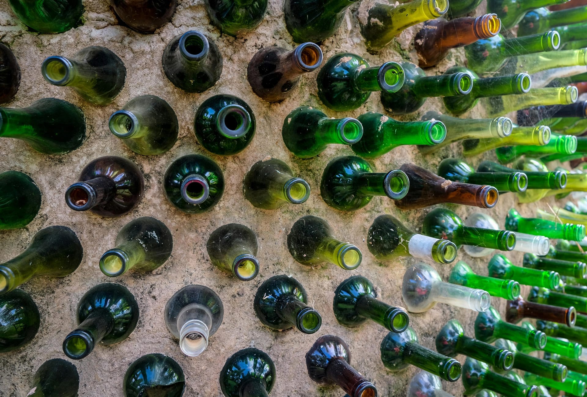 bottle wall. A wall where glass bottles have been used to save the amount of concrete being used