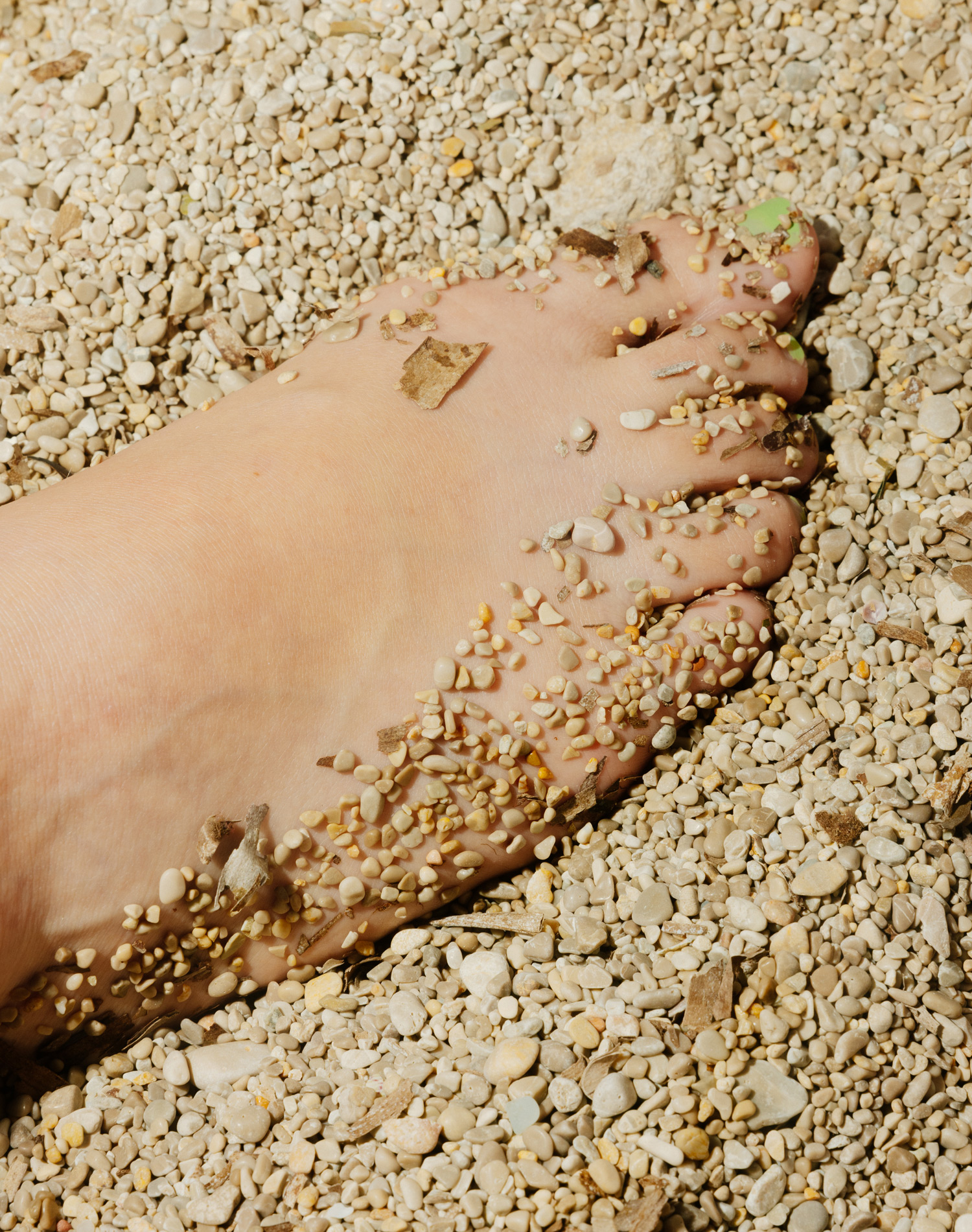 foot covered in rough sand