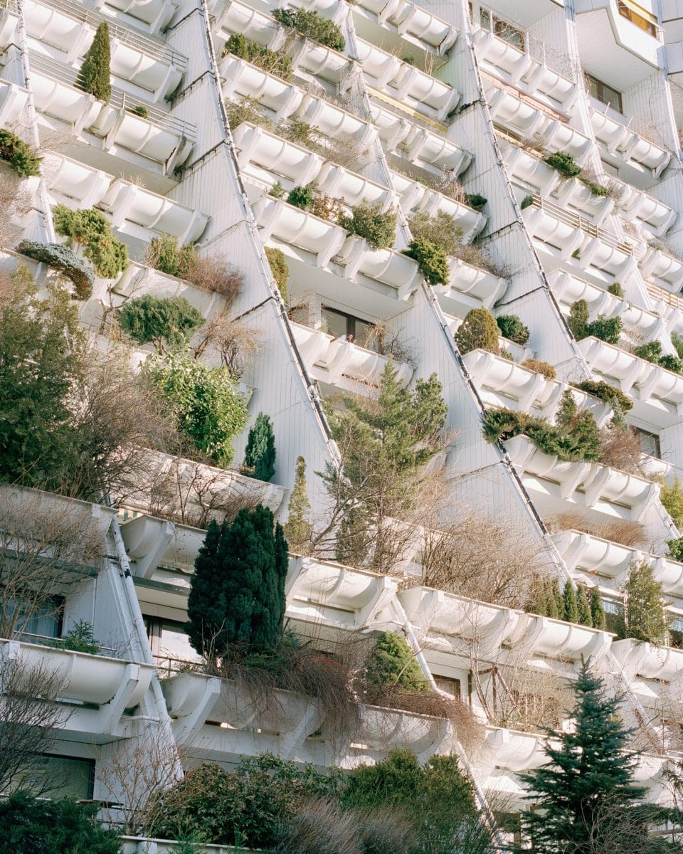 The Alterlaa complex in Vienna, Austria is a good example of architecture incorporating urban rewilding by giving each apartment a large balcony with a 4 m2 (43 sq ft) trough planter in front of it.