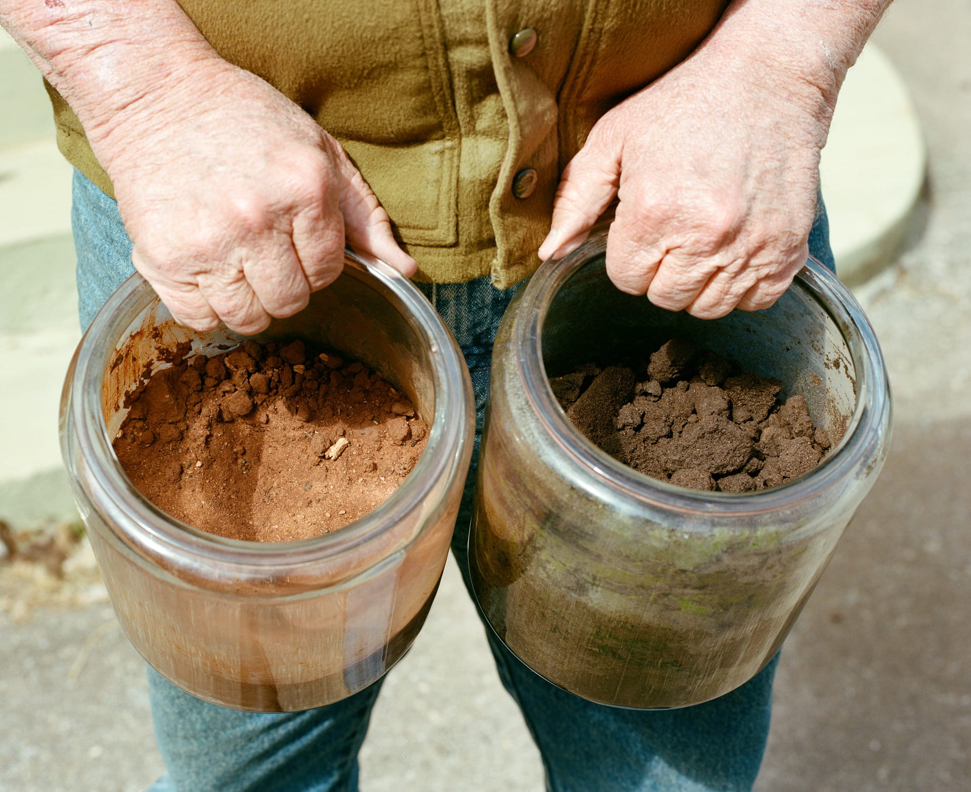 Soil samples showing the difference in color and texture of industrialized farm next door vs White Oak Pastures. Reddish soil is the industrialized farm which discolors the natural soil.